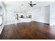 Open living space with hardwood floors and kitchen views at 34434 Windknob Ct, Wesley Chapel, FL 33545
