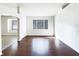 Spacious living room featuring hardwood floors and lots of natural light at 34434 Windknob Ct, Wesley Chapel, FL 33545