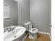 Clean and updated bathroom with a pedestal sink and neutral decor at 4580 Limerick Dr, Tampa, FL 33610