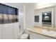 Full bathroom with a shower/tub combination and a neutral vanity at 15427 Winter Breeze Ln, Wimauma, FL 33598