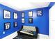 Bedroom featuring a futon, a sporty theme, and blue walls at 15427 Winter Breeze Ln, Wimauma, FL 33598
