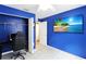 Bright bedroom with a closet and door leading to another room featuring vinyl floors and a modern ceiling fan at 15427 Winter Breeze Ln, Wimauma, FL 33598