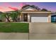 Charming one-story home with a well-manicured lawn and two-car garage at 15427 Winter Breeze Ln, Wimauma, FL 33598