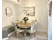 Charming dining area with a round table and floral-patterned chairs at 6302 Rosefinch Ct # 104, Lakewood Ranch, FL 34202