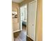 Light hallway with wood flooring and access to a bedroom and closet at 6302 Rosefinch Ct # 104, Lakewood Ranch, FL 34202
