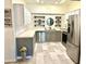 Modern kitchen with stainless steel appliances and stylish gray cabinets at 6302 Rosefinch Ct # 104, Lakewood Ranch, FL 34202
