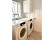 Convenient laundry room with front-load washer and dryer at 6302 Rosefinch Ct # 104, Lakewood Ranch, FL 34202