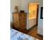 Bedroom view towards a vanity with white cabinets and a large mirror at 1322 Pelican Creek Xing # B, St Petersburg, FL 33707