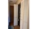 Bedroom closet with white bi-fold doors and hanging clothes at 1322 Pelican Creek Xing # B, St Petersburg, FL 33707