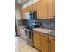 Kitchen featuring stainless steel oven and wood cabinets at 1322 Pelican Creek Xing # B, St Petersburg, FL 33707