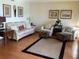 Well-lit living room showcases comfortable seating and stylish decor at 1322 Pelican Creek Xing # B, St Petersburg, FL 33707