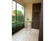 Screened patio with a glass table, offering a relaxing outdoor space at 1322 Pelican Creek Xing # B, St Petersburg, FL 33707