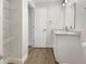 Clean bathroom with granite countertop vanity and new flooring at 4642 Spahn St, Sarasota, FL 34232