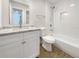 Updated bathroom with granite vanity and a new bathtub at 4642 Spahn St, Sarasota, FL 34232