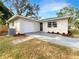 Newly renovated single story home with attached garage and landscaped yard at 4642 Spahn St, Sarasota, FL 34232