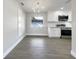 Remodeled kitchen features white cabinets, granite countertops, and stainless steel appliances at 4642 Spahn St, Sarasota, FL 34232