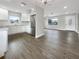 Open concept kitchen and living area with new flooring throughout at 4642 Spahn St, Sarasota, FL 34232