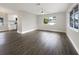 Open concept living and kitchen area with wood-look floors at 4642 Spahn St, Sarasota, FL 34232