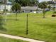 Landscaped lawn with palm trees and community building in background at 4895 Bay Ne St # 207, St Petersburg, FL 33703