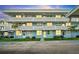 Two-story condo building with lighted balconies and parking at 4895 Bay Ne St # 207, St Petersburg, FL 33703