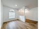 Light and airy living room with hardwood floors and an arched doorway at 12926 Carlington Ln, Riverview, FL 33579