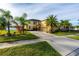 Two-story house with palm trees and a large driveway at 20102 Blue Daze Ave, Tampa, FL 33647