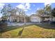 Large backyard with covered patio and detached garage at 4613 W Fair Oaks Ave, Tampa, FL 33611