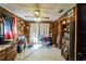 Spacious living room featuring wood paneling and tiled floors at 4613 W Fair Oaks Ave, Tampa, FL 33611