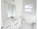 Bright bathroom with a single sink vanity and modern fixtures at 37 Warrington Blvd, Port Charlotte, FL 33954
