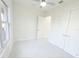 Bright bedroom with double closets, large windows, and tiled floors at 37 Warrington Blvd, Port Charlotte, FL 33954