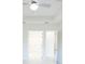 Spacious bedroom featuring multiple doorways and a modern ceiling fan at 37 Warrington Blvd, Port Charlotte, FL 33954