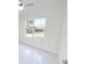 Bright bedroom with large window and a view of the outdoors at 37 Warrington Blvd, Port Charlotte, FL 33954
