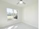 Bright bedroom with large window and a view of the outdoors at 37 Warrington Blvd, Port Charlotte, FL 33954