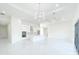 Modern kitchen with stainless steel appliances, a center island, and stylish pendant lighting, blending functionality and design at 37 Warrington Blvd, Port Charlotte, FL 33954