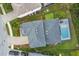 An aerial view highlights the home, pool, and surrounding landscaping within the neighborhood at 7480 Aguila Dr, Sarasota, FL 34240