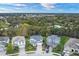 An aerial view of multiple homes in a wooded community at 7480 Aguila Dr, Sarasota, FL 34240