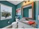 Stylish bathroom with granite countertop, vanity, and a window with tropical view at 7480 Aguila Dr, Sarasota, FL 34240