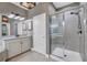Bathroom with walk-in shower and granite countertops at 7480 Aguila Dr, Sarasota, FL 34240