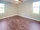 Bedroom with tile floor and natural light at 7480 Aguila Dr, Sarasota, FL 34240
