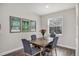 Cozy dining area with modern decor and natural light from a bright window at 7480 Aguila Dr, Sarasota, FL 34240