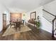Bright dining room with hardwood floors and a large decorative wall at 7480 Aguila Dr, Sarasota, FL 34240