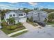 Beautiful, two-story homes with well-maintained landscaping, paved driveways, and attached two-car garages at 7480 Aguila Dr, Sarasota, FL 34240