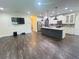 Open-concept kitchen featuring a large island, stainless steel appliances and modern decor at 7480 Aguila Dr, Sarasota, FL 34240