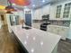 Modern kitchen features stainless steel appliances, granite countertops, and a decorative tile backsplash at 7480 Aguila Dr, Sarasota, FL 34240