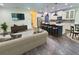 Open living space with hardwood flooring, a spacious layout, and natural light at 7480 Aguila Dr, Sarasota, FL 34240
