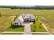 Aerial view of home and surrounding landscape showing the expansive yard and surrounding properties at 14036 Prairie Hill Rd, Dade City, FL 33525