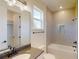 Modern bathroom featuring a vanity, toilet, shower and tub with tile surround, offering a relaxing retreat at 14036 Prairie Hill Rd, Dade City, FL 33525