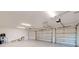 Spacious three-car garage with ample room for storage and overhead lighting at 14036 Prairie Hill Rd, Dade City, FL 33525