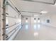 The garage features a sparkling epoxy floor, bright lighting, and plentiful space at 14036 Prairie Hill Rd, Dade City, FL 33525