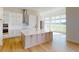 Gourmet kitchen with stainless steel appliances, a large island, and natural light at 14036 Prairie Hill Rd, Dade City, FL 33525